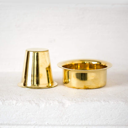 brass davra set with upside down glass