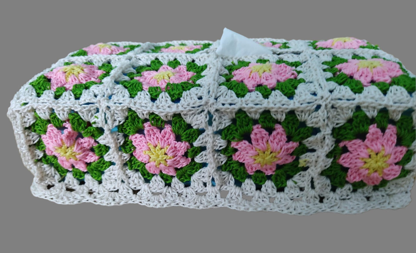 crochet tissue box made of granny squares with pink flowers