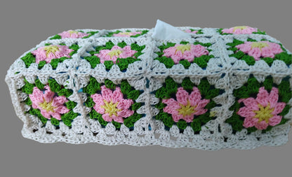 crochet tissue box made of granny squares with pink flowers