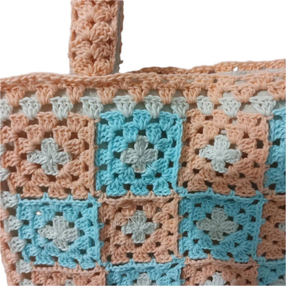 orange and blue tote bag zoomed in